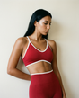 Red AYRAWER DYNAMIC SET featuring vibrant red fabric and tailored design, displayed on a seamless background.