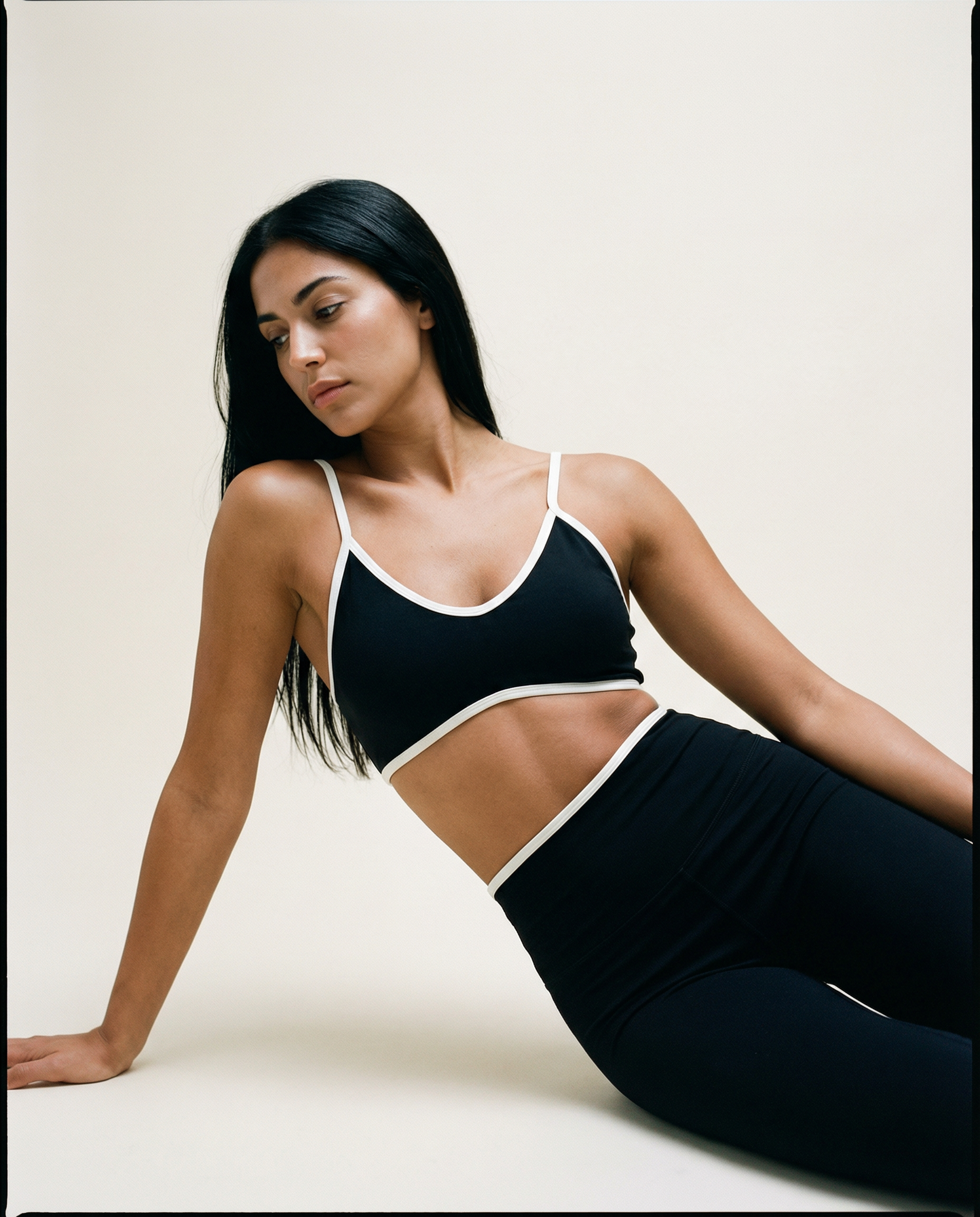 Black Sculpted Motion seamless activewear top by AYRAWER, featuring a fitted design and smooth fabric for workout comfort.